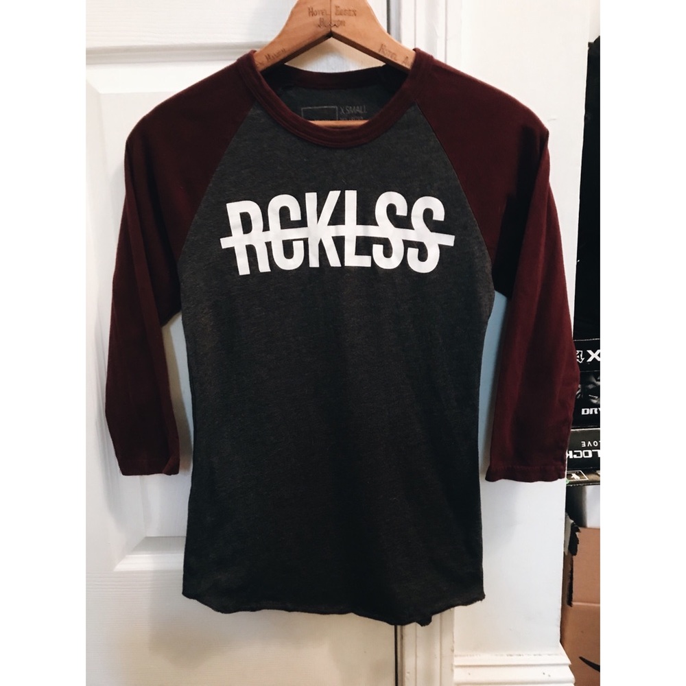 Xs woman’s young and reckless baseball t